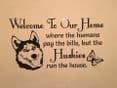 Welcome To Our Home Where Humans Pay The Bills, But The Husky or Huskies Runs The House - Husky Wall Sticker